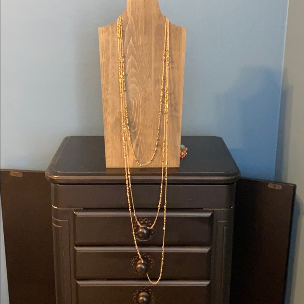 Gold colored three tiered necklace